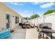 Back patio featuring outdoor seating, a grill, and a well-maintained fence for privacy and relaxation at 1004 Gold Cir, Mebane, NC 27302
