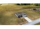 Drone image of a well-kept property showing a paved driveway leading up to the home at 105 Seminole Fields Dr, Broadway, NC 27505
