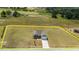 An aerial view of a charming home on a spacious lot, framed by picturesque landscapes and clear property lines at 105 Seminole Fields Dr, Broadway, NC 27505