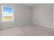 A bright bedroom featuring neutral carpet, a double window, and a comfortable, inviting atmosphere at 105 Seminole Fields Dr, Broadway, NC 27505