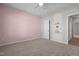 Bedroom features pink trim, shelves and an arched door frame to the hallway at 105 Seminole Fields Dr, Broadway, NC 27505