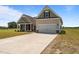 Lovely home with a two-car garage, attractive landscaping, and a spacious driveway at 105 Seminole Fields Dr, Broadway, NC 27505