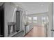 Bright kitchen features stainless steel refrigerator, gray cabinets, granite countertops, and backyard views at 105 Seminole Fields Dr, Broadway, NC 27505
