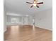 Spacious living room with wood-look flooring, ceiling fan, and lots of natural light at 105 Seminole Fields Dr, Broadway, NC 27505