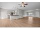 Open floorplan with kitchen, living room, and dining room featuring wood-look flooring and lots of light at 105 Seminole Fields Dr, Broadway, NC 27505