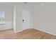 Bright living area featuring wood floors and a stylish white interior door at 105 Seminole Fields Dr, Broadway, NC 27505