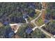 An aerial view of homes nestled among lush trees on Little Bend Ct and N Duelling Oaks Dr at 106 N Duelling Oaks Dr, Chapel Hill, NC 27517