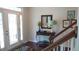 Welcoming foyer with hardwood floors, decorative table, mirror, and artwork, setting a stylish tone at 106 N Duelling Oaks Dr, Chapel Hill, NC 27517