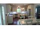 Spacious eat-in kitchen with island, granite countertops, stainless steel appliances, and tile backsplash at 106 N Duelling Oaks Dr, Chapel Hill, NC 27517