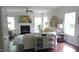 Bright living room with a fireplace, hardwood floors, and abundant natural light at 106 N Duelling Oaks Dr, Chapel Hill, NC 27517