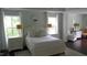 Elegant main bedroom featuring dark wood floors, white furniture, and decorative pillows at 106 N Duelling Oaks Dr, Chapel Hill, NC 27517