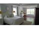 Spacious main bedroom with tray ceiling, multiple windows, and dark wood flooring at 106 N Duelling Oaks Dr, Chapel Hill, NC 27517