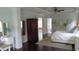 Bright main bedroom with and furniture, dark wood floors, and ensuite access at 106 N Duelling Oaks Dr, Chapel Hill, NC 27517