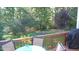 Outdoor patio with dining area and grill surrounded by lush greenery at 106 N Duelling Oaks Dr, Chapel Hill, NC 27517