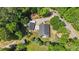 Aerial view of a single-Gathering home, RV garage, and mature trees at 109 Rustler Rd, Louisburg, NC 27549