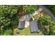 Overhead view of home with long driveway, guest house, shed and fire pit in the backyard at 109 Rustler Rd, Louisburg, NC 27549