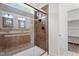 Bathroom features brown tile shower with glass door at 109 Rustler Rd, Louisburg, NC 27549