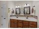 Bathroom with double vanity, stylish mirrors, and ample storage space at 109 Rustler Rd, Louisburg, NC 27549