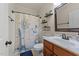 Nautical themed bathroom featuring a vanity with a white marble countertop and a compass-print shower curtain at 109 Rustler Rd, Louisburg, NC 27549