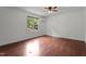 Bedroom with hardwood floors, a ceiling fan, and a window that brings in natural light at 109 Rustler Rd, Louisburg, NC 27549