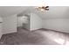 Upstairs bonus room with carpeted floors, neutral walls, and a vaulted ceiling at 109 Rustler Rd, Louisburg, NC 27549