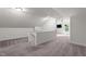 Large bonus room featuring a ceiling fan, carpeted floors, and plenty of natural light at 109 Rustler Rd, Louisburg, NC 27549