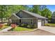 Attractive home featuring an attached garage, welcoming porch, and landscaped front yard at 109 Rustler Rd, Louisburg, NC 27549