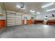 Spacious garage interior with concrete flooring and lots of workspace and storage area at 109 Rustler Rd, Louisburg, NC 27549