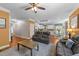 Open concept living room showcasing hardwood floors that flow into an eat-in kitchen with granite countertops at 109 Rustler Rd, Louisburg, NC 27549