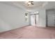 Spacious main bedroom with a decorative tray ceiling, ceiling fan, and barn door at 109 Rustler Rd, Louisburg, NC 27549