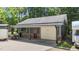 This outbuilding includes a single garage door and an attached lean-to at 109 Rustler Rd, Louisburg, NC 27549
