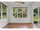 Sunroom boasts large windows and sliding doors offering great views of the landscaped yard at 109 Rustler Rd, Louisburg, NC 27549