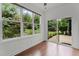 Sunroom boasts large windows and sliding doors offering great views of the landscaped yard at 109 Rustler Rd, Louisburg, NC 27549
