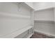 Walk-in closet with white shelving and storage space at 109 Rustler Rd, Louisburg, NC 27549
