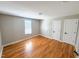 Bedroom with wood floors, neutral walls, and plenty of natural light from the windows at 1100 Chester St, Durham, NC 27701