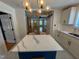 Bright kitchen features a marble countertop, island, and view to the living room at 1100 Chester St, Durham, NC 27701