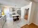 Modern kitchen featuring a stylish island with seating, stainless steel appliances, and elegant white cabinetry at 1100 Chester St, Durham, NC 27701