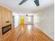 Bright living room featuring sleek wood floors, a modern fireplace, unique wall accents, and an open layout at 1100 Chester St, Durham, NC 27701
