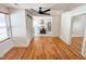 Bright living room featuring sleek wood floors, a modern fireplace, unique wall accents, and an open layout at 1100 Chester St, Durham, NC 27701