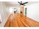 Bright living room featuring sleek wood floors, a modern fireplace, unique wall accents, and an open layout at 1100 Chester St, Durham, NC 27701
