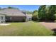 Lush backyard with healthy lawn, featuring a patio and views of the home's rear exterior at 115 Moss Creek Pl, Fuquay Varina, NC 27526