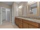 Beautiful bathroom with granite counters, dual sinks, and access to a walk-in closet at 115 Moss Creek Pl, Fuquay Varina, NC 27526