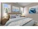 Cozy bedroom with nautical themed decor, soft lighting, and plush bedding at 115 Moss Creek Pl, Fuquay Varina, NC 27526