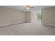 Spacious bedroom with a ceiling fan and a large window offering natural light at 115 Moss Creek Pl, Fuquay Varina, NC 27526