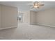 Expansive bedroom featuring a ceiling fan, window, and plush carpeting at 115 Moss Creek Pl, Fuquay Varina, NC 27526