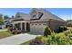 Charming brick home with a well-manicured lawn and attached garage at 115 Moss Creek Pl, Fuquay Varina, NC 27526