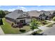 Aerial view of brick homes with well-kept lawns, gardens, and tree-lined streets at 115 Moss Creek Pl, Fuquay Varina, NC 27526