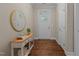 Inviting entry way with stylish console table, decor, and plenty of natural light at 115 Moss Creek Pl, Fuquay Varina, NC 27526