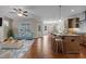 Inviting living space with island seating, stainless steel appliances, and backyard access at 115 Moss Creek Pl, Fuquay Varina, NC 27526