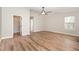 Spacious bedroom with modern ceiling fan and natural light from the window at 11700 Coppergate Dr # 100, Raleigh, NC 27614